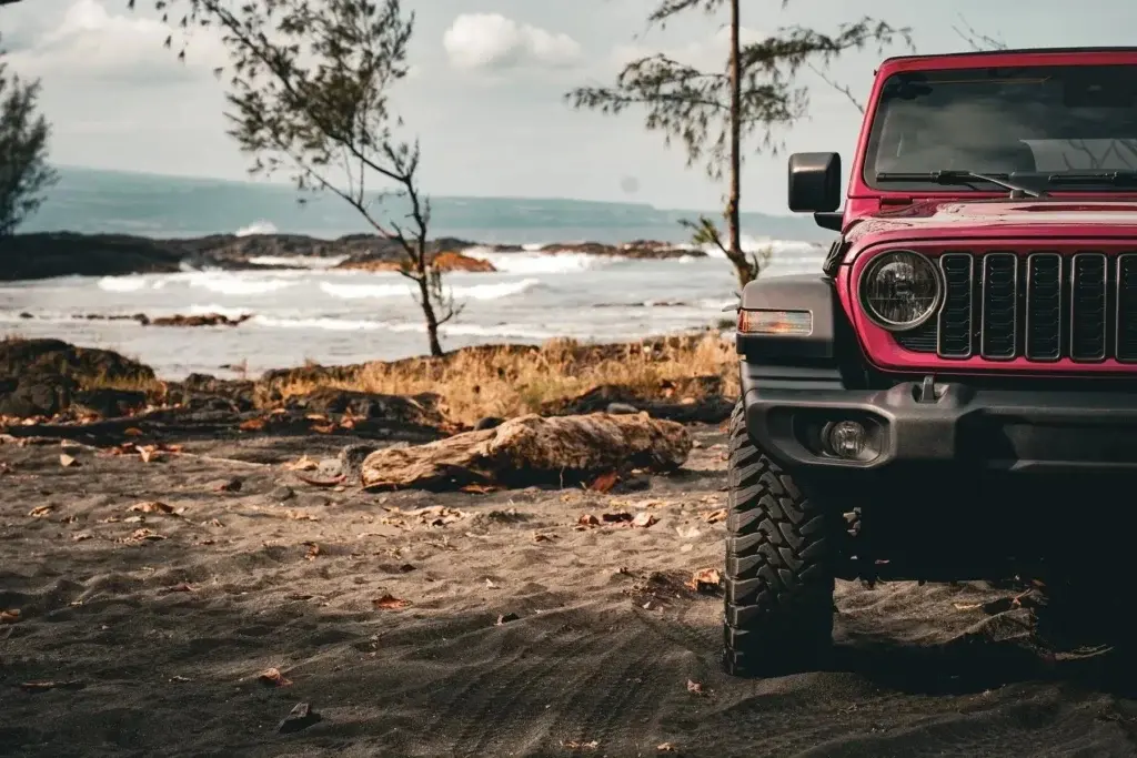 Wrangler on a Kauaʻi beach at sunset